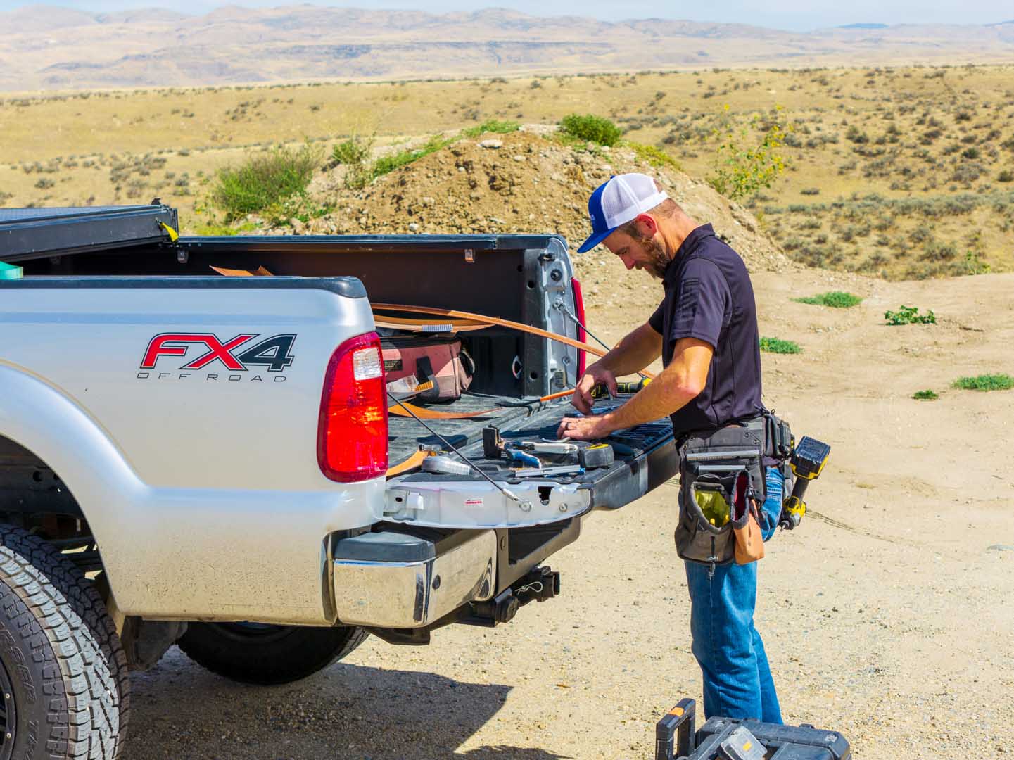 An employee working out of his truck during a work project