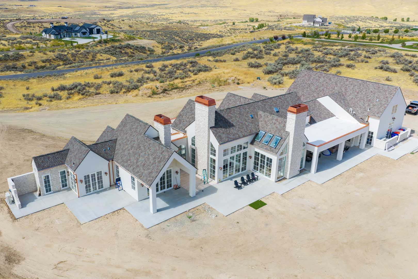 an arial view of a house in the foothills of Idaho with a new roof.