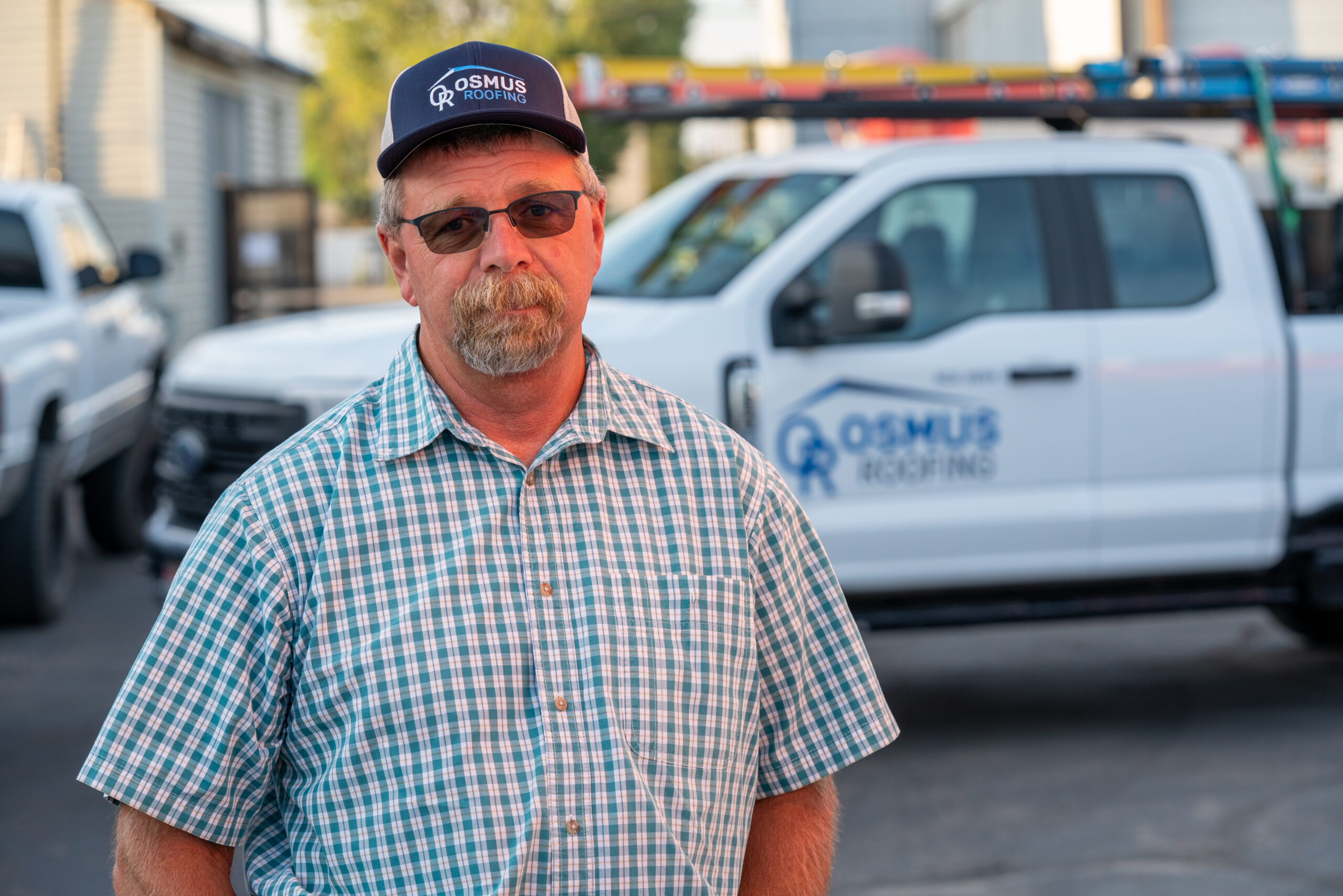 Osmus Roofing owner with company truck